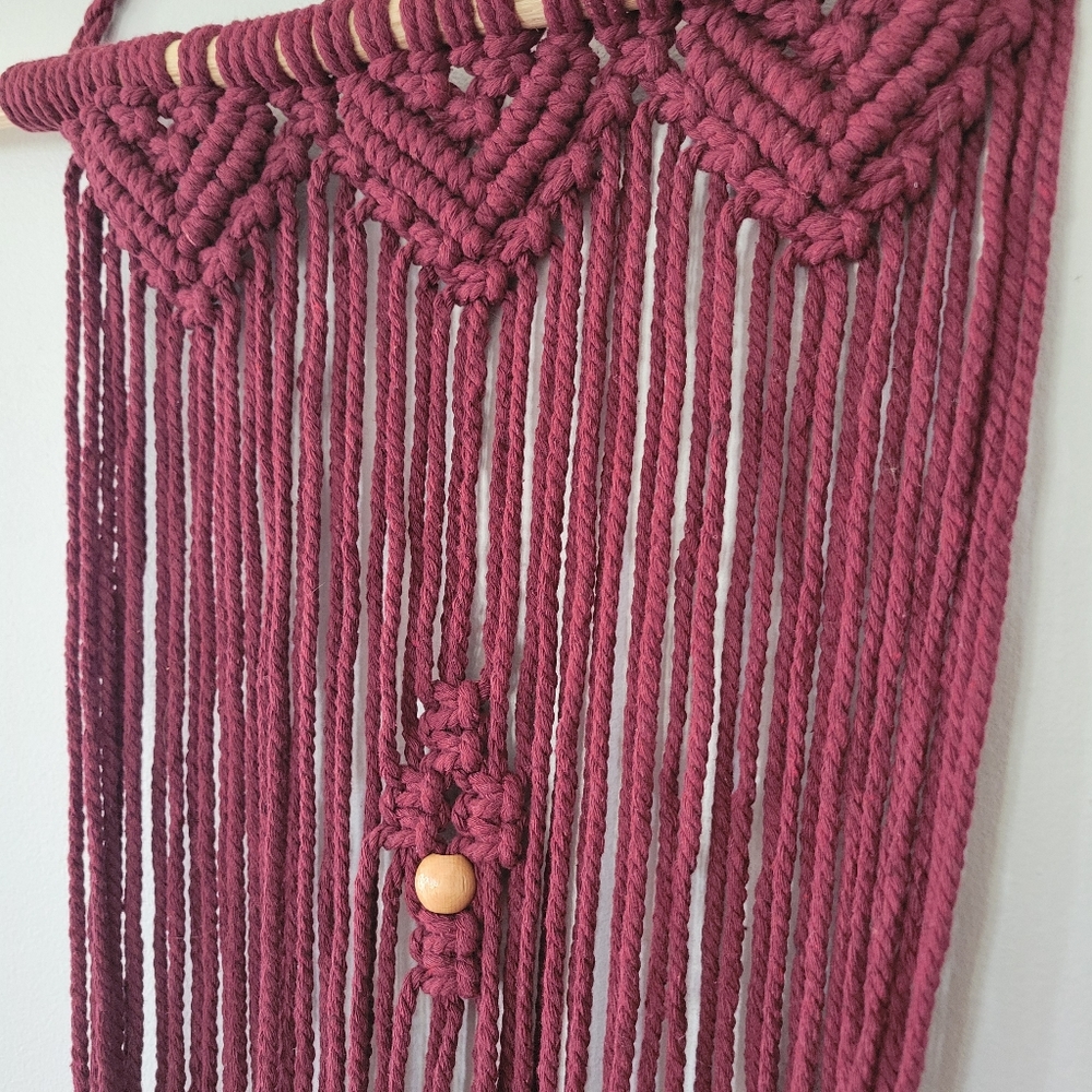 Large maroon macrame wall hanging‎